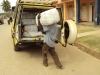 King David Sec. - A volunteer unloads a pack of nets for distribution.