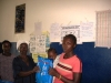 Butaw Clinic - mother with child receiving her net (inside the blue package)