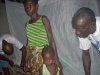 Mother learning how to use the mosquito net