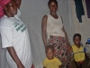 Mother with two children in front of bed with net