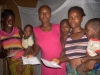 Family in front of bed with net