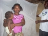 Mother and child in front of assembled mosquito net