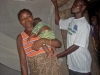 Mother and child in front of assembled mosquito net