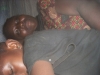 Family sleeping under the mosquito net