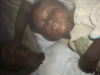 Family sleeping under the mosquito net