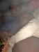 Family laying under the mosquito net