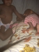Family laying under the mosquito net