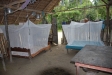 This house in Sachapapa has little to protect sleepers from the elements other than their new nets.