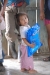 A youngster holding a life saving bednet for herself and her family. Children under five account for about one million deaths a year from malaria.