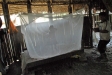 After setting up her bednet in Santa Rosa, a young girl tries out her tent.