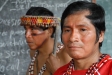 The chief and a local government agent participate in the net distribution in Sinchi Roca.