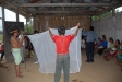 Demonstrating the proper set up of a bednet in Sinchi Roca