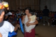Woman and child receive a bednet in Sinchi Roca.