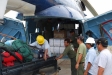 Loading nets (in the large white bags) into a helicopter in Peru is one of many steps in the delivery process.