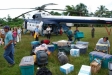 Landing by helicopter in Napuruka, Peru, volunteers organize supplies for distribution
