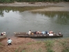 Nets and supplies are loaded into canoes in Sacapapa. Difficulty in traveling limits or eliminates access to medical services, so malaria prevention is key.