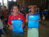 Modern and traditional men in Sinchi Roca give approval of the bednet program in Peru.