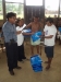The chief of the village of Kuji accepts nets on behald of his village in Sinchi Roca.