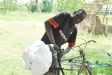 A man attaches his net to his transportation.