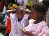 Two young girls all dressed up for the community bednet lesson.