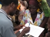 A woman registers her family to receive nets.