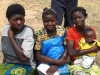 Two mothers await their new nets. During pregnancy mothers are at risk of placental infection by malaria which puts them at high risk for sickness and death especially during their first pregnancy.
