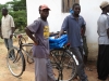 Community members prepare to take their new long lasting insecticide nets home