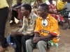 Community members gather for a lesson on proper bednet care and use.