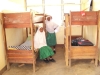 Mnyambe Sec. - Two students show off their room, which had no protective bed nets before distribution.
