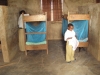 Mnyambe Sec. - A young student removes an LLIN from its packaging.