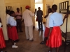 Lukuledi Sec. - Before distribution, a volunteer checks sleeping spaces to see how many LLINs are needed.