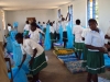 KISIWA SEC: The girls get straight to work hanging a network of strings.