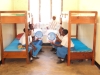 Mustapha Sabodo Sec. - Students display the brand new nets that will be hung in their room.