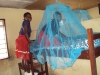 Students in Nanguruwe Secondary school help hang their new nets. All students in the school will sleep safely tonight!