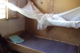 Dodoma School for the Deaf: The nets being safely stored above the beds when not in use.