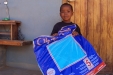 Kibakwe School: One young child happily holds their new net!