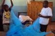 Buigiri School for the Blind: The children and the volunteers work together to install the nets.