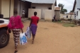 Embeko School: At Embeko School, the young female students carry the nets into their dormitory.