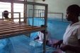 Chikopelo School: The students begin to install the mosquito nets.