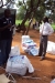 Mpwapwa Sec: The LLINs are carefully unloaded from the truck while the headmaster looks on.