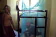Mpwapwa Sec: ...while a girl rests after her and her friend have successfully installed her net.