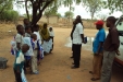 Zamzam: The young children listen attentively while holding their new bednets.