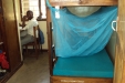 Mvumi School: One student sits studying after quickly erecting his net...