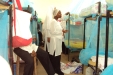 Hijira School: The headmistress checks that all of the nets are being correctly installed...