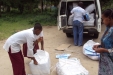 Abeid Amani School: The students and teachers help to unload the bundles of nets from the truck...