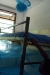 Abeid Amani School: The nets are carefully attached to the underside of the beds.