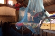 MPUNGUZI The students learn how to completely seal off their bed space from mosquitos.