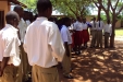 Kigwe Secondary: Students listen to a presentaion on the proper use and value of a bednet in preventing malaria. Education is another key to preventions in Tanzania.