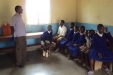 Hombolo: A volunteer discusses how to use the nets with some of the youngest children.