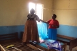 Hombolo: The caregivers install the 50 nets that are required to protect every sleeping space.